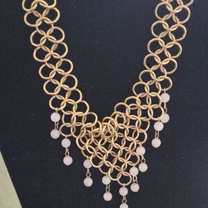 Elegant Gold Necklace with Pink Accents